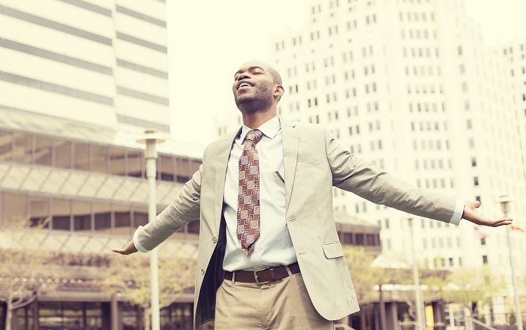 a confident man wearing a suit in the city